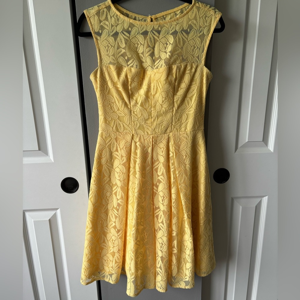 Yellow lacy dress with a yellow lining.